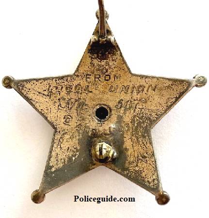 Back of badge is engraved:  From Local Union No. 607 C. and J. of A.  Union 607  Labor District of greater St. Louis for The United Brotherhood of Carpenters and Joiners of America
