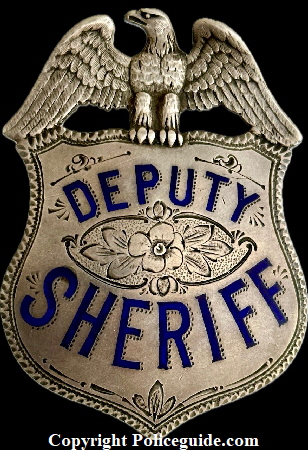 Alameda Co. Deputy Sheriff eagle top shield, Presented to Jack Banchio by Frank Barnet Sheriff 1923.  Sterling silver with hard fired blue enamel.