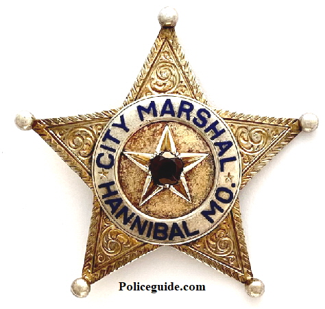City Marshal badge Hannibal, MO.  Gold front over sterling silver adorned with a garnett.