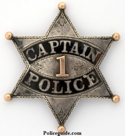 W.C. Roberts' LAPD Series 2 Captain's presentation badge, made of sterling silver with hard fired black enamel, an applied number 1 and hand chased engraving.