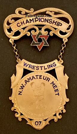 Championship Wrestling N. W. Ameateur Meet / Heavyweight 07.  14k gold.