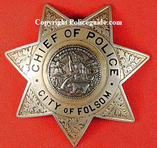 Chief of Police badges for Folsom, CA worn by Edward E. Fausset who was Folsom's first Chief from 1946 until his death in 1951. Badges were obtained from his son, Wm. Fausset on April 6, 1987.
