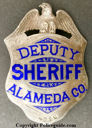 Alameda Co. Deputy Sheriff, sterling silver, hand engraved. Made by Oakland Jeweler and watchmaker George Fake.  Noted Alameda County historian and collector James Bolander advised me that this badge is the first deparment issue and that after the deparment went to a new style, these badges were numbered and issued to Special Deputies.  SKU3591