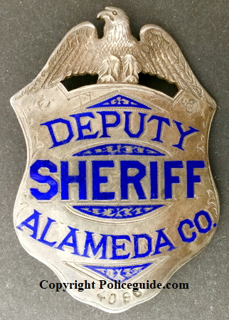 Alameda Co. Deputy Sheriff, sterling silver, hand engraved. Made by Oakland Jeweler and watchmaker George Fake.� Noted Alameda County historian and collector James Bolander advised me that this badge is the first deparment issue and that after the deparment went to a new style, these badges were numbered and issued to Special Deputies.