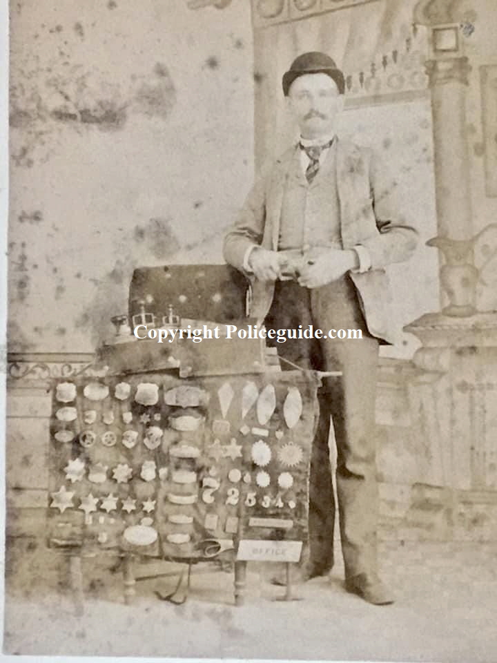 The traveling badge peddler with his display, circa 1880.