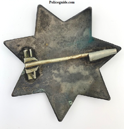 Back of San Francisco Police star #11 showing largt T-pin and Tube catch.  Hallmarked J. C. Irvine 339 Kearny St. S. F.