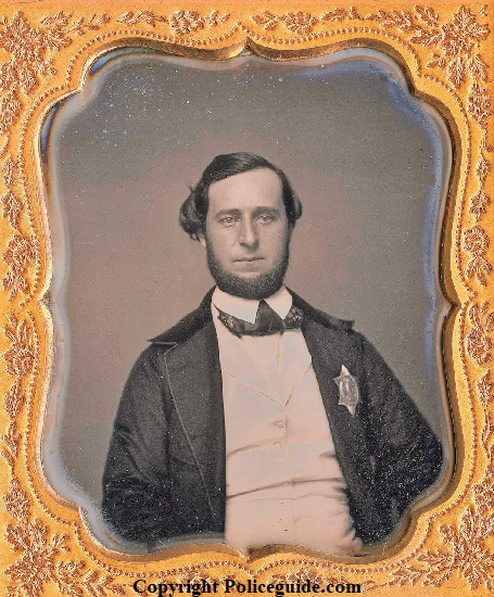 Daguerreotype of Boston Police officer wearing the 1st issue shield, issued in 1853. Daguerreotype of Boston Police officer wearing the 1st issue shield, issued in 1853.
