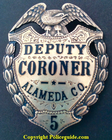 Alameda Co. Deputy Coroner #5, sterling silver, hard fired black enamel and hand engraved.  Made by Ed Jones Co. Oakland, CAL