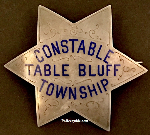 Constable Table Bluff Township (Loleta) is made of sterling silver with hard fired blue enamel and hand engraved.  Circa 1910.
