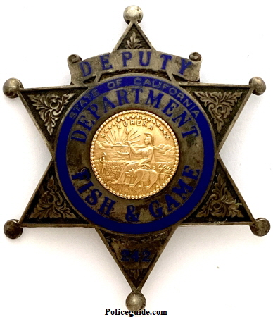 State of California Department of Fish & Game badge #242.  Hallmarked Ed Jones & Co. Oakland, CAL Sterling Gold Front.