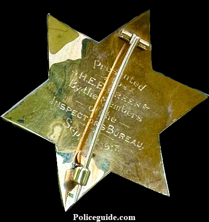 Back of Captain of inspectors badge showing presentation: Presented to H. E. E. Green By the Members of the Inspectors bureau Sept. 1st, 1917