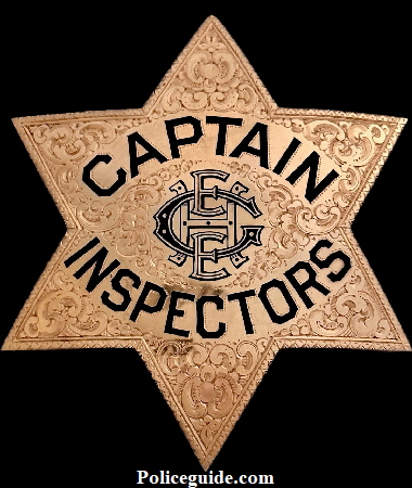 14k gold presentation Captain of Inspectors badge with monogramed initials in the center H E E G