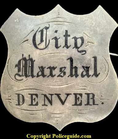 Denver City Marshal shield made of sterling silver with hard fired black enamel. Jeweler made. Worn by David Cook who served from 1866 to 1869 Denver City Marshal shield made of sterling silver with hard fired black enamel. Jeweler made. Worn by David Cook who served from 1866 to 1869