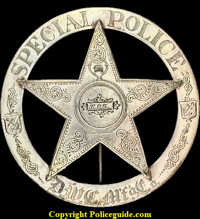 Interesting design with the Pocket Watch design in the center and the anchor in shield decorations on the sides.  In the center are the initials B. Ott and on the botttom “D.W.C. Mft. Co. which stands for Dueber Watch Case Co. Newport, KY established in 1864 and continuing into the early 1880’s where it merged with Hampden Watch Co. and became the Dueber Hampden Watch Co. moving to Canton, OH in 1888.