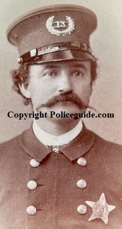 Denver police officer wearing star No. 13.