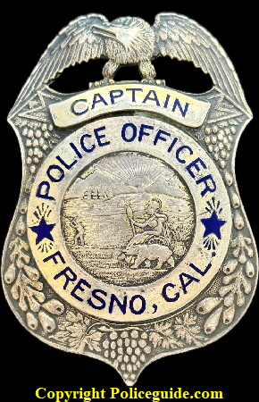 Fresno Police Captain, jeweler made by A.S. Shaddow, a Fresno Jeweler.  The shield is sterling silver with hard fired blue enamel lettering and decoratexd with grape clusters and vines.  