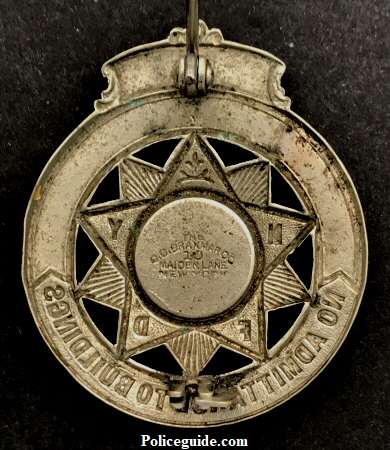 1907 Kenneth F. Sutherland Fire Lines badge reverse.  Hallmarked The C. G. Braxmar Co. 10 Maiden Lane New York.