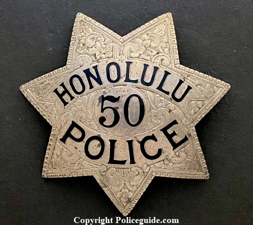 Honolulu Police badge #50, sterling with hard fired black enamel and hand engraved.  Made by Ed Jones Oakland, CAL.