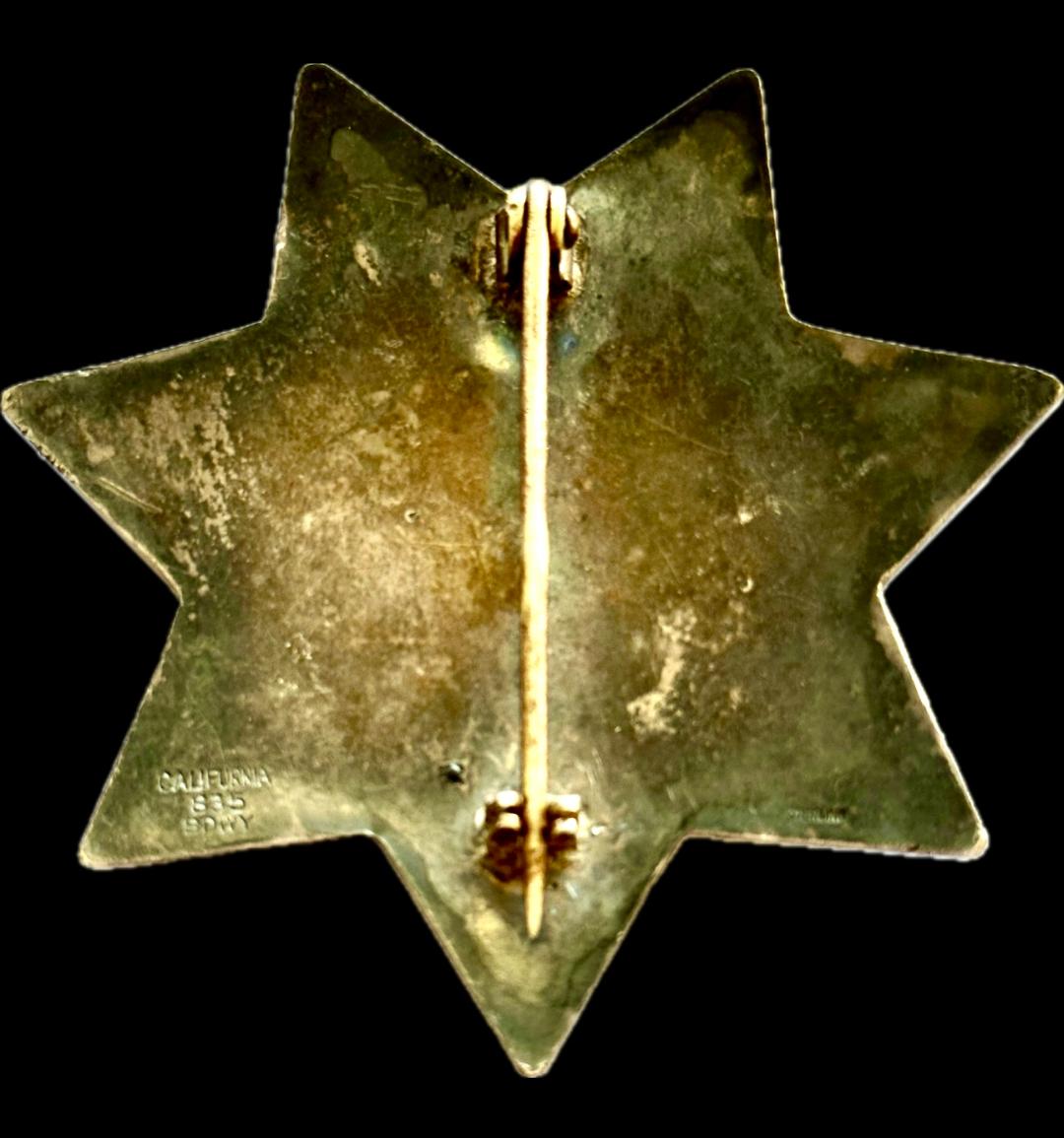 Hayward Deputy Marshal star made of sterling silver with hard fired blue enamel and beautifully engraved.  Made by California 835 Bdwy Oakland, CAL.