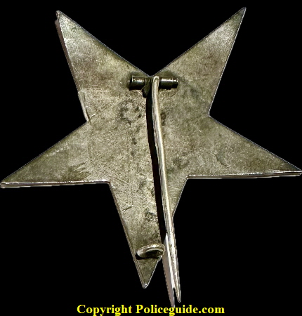 Early Indianapolis Police star with the initials W H in the center.