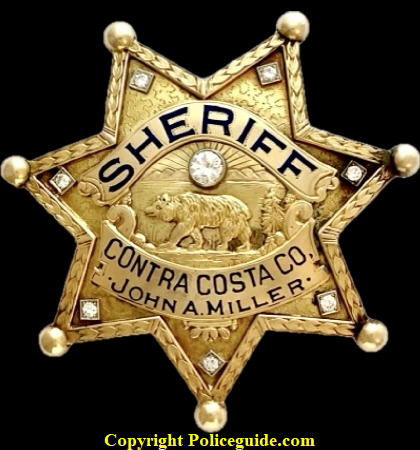14k gold badge presented to newly elected Sheriff John A. Miller May 19, 1935.  He was in office 1935-1943.   Hallmarked Jones 14k