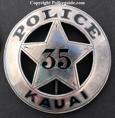 Police badge #35 Kauai.  Sterling silver with hard fired black enamel.