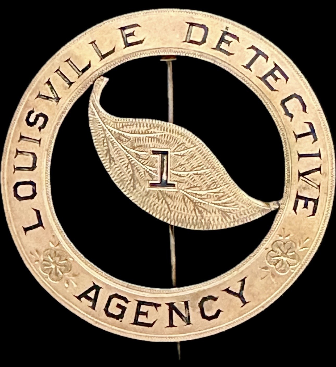 Louisville Detevtive Agency No. 1 with a tobacco leaf in the center.  14k gold.