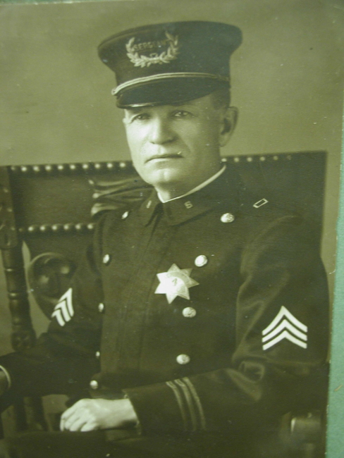 Sacramento Sergeant Max Fisher wearing badge #4 made by J. N. Phillips Jeweler Sacramento.
