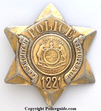 Kansas City MO Police Radio  badge No. 1221.