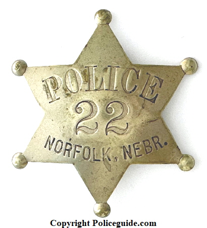 Norfolk Nebraska Police badge No. 22 made by J. P. Cooke Co. Mfg’s Omaha, NEB. Norfolk Nebraska Police badge No. 22 made by J. P. Cooke Co. Mfg’s Omaha, NEB.