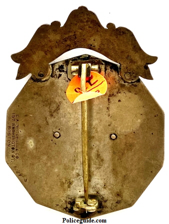 Newton Police Chief badge obverse of badge showing T pin and fork catch.  Fork catch has a patent date 1864 stamped on it and the badge maker hallmark is C. A. Twitchell & Co. 157 Washington St. Boston.