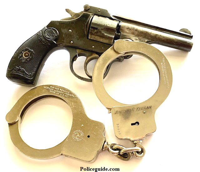 Officer Keegan's  gun and handcuffs.