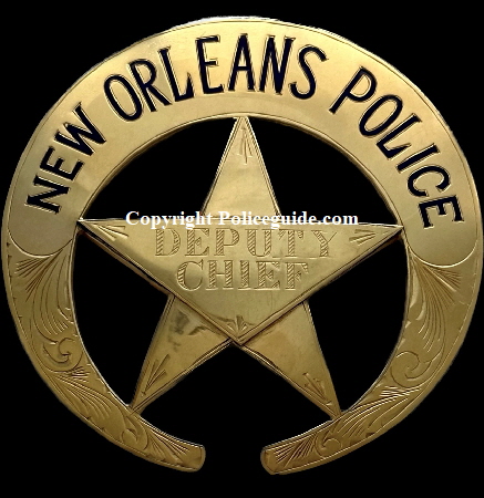 New Orleans Police Deputy Chief badge, presented in  1962, 14k gold,  with black enameled lettering and hand engraved lettering for the rank.