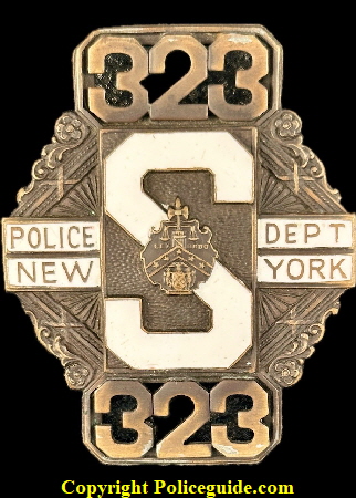 New York Police shield No. 323  for the Prohibition Special Unit. A short lived shield due to the fact that Mobsters could easily identify the Prohibition officers (known as at the Hat Squad) due to their unique shields.