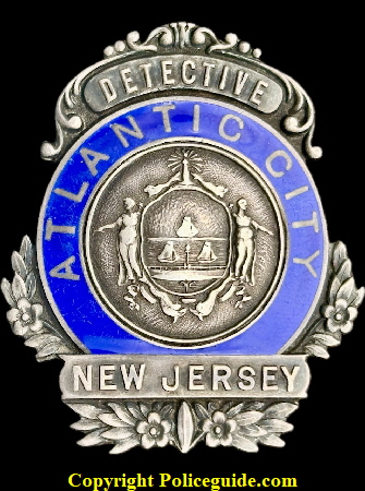 Atlantic City Detective shield, sterling silver with hard fired blue reverse enamel lettering.  Made by S. P. Durry Phila.  Sterling silver.