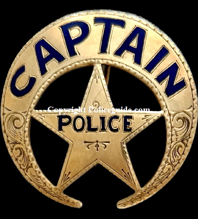New Orleans Police Captain badge, circa 1940, 14k gold,  with blue and black enameled lettering.