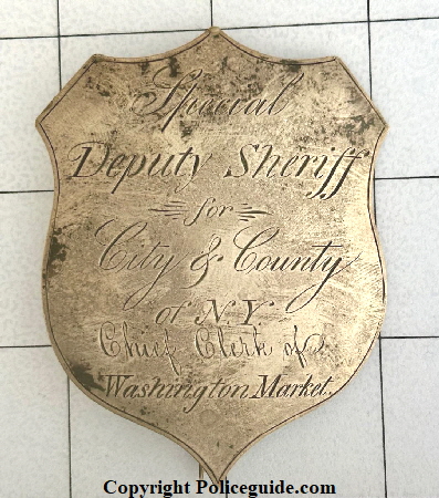 Early and rare Special Deputy Sheriff for City & County of N. Y. Chief Clerk of Washington Market.  Sheet silver with T-pin and C-catch.