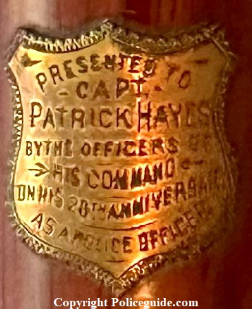 Presented to Capt. Patrick Hayes by the officers of his command on his 20th anniversary as a police officer.