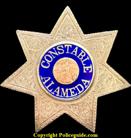 Constable Alameda (City of) sterling silver star with reverse blue enamel lettering and a karat gold center seal.  Star measures 3 1/4’ tall.  C.M. Day was elected Constable in 1893 and served until he resigned in 1898 to go into retail business..