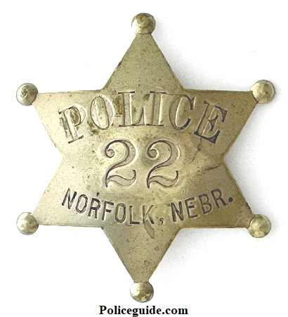 Norfolk Nebraska Police badge No. 22 made by J. P. Cooke Co. Mfg’s Omaha, NEB.