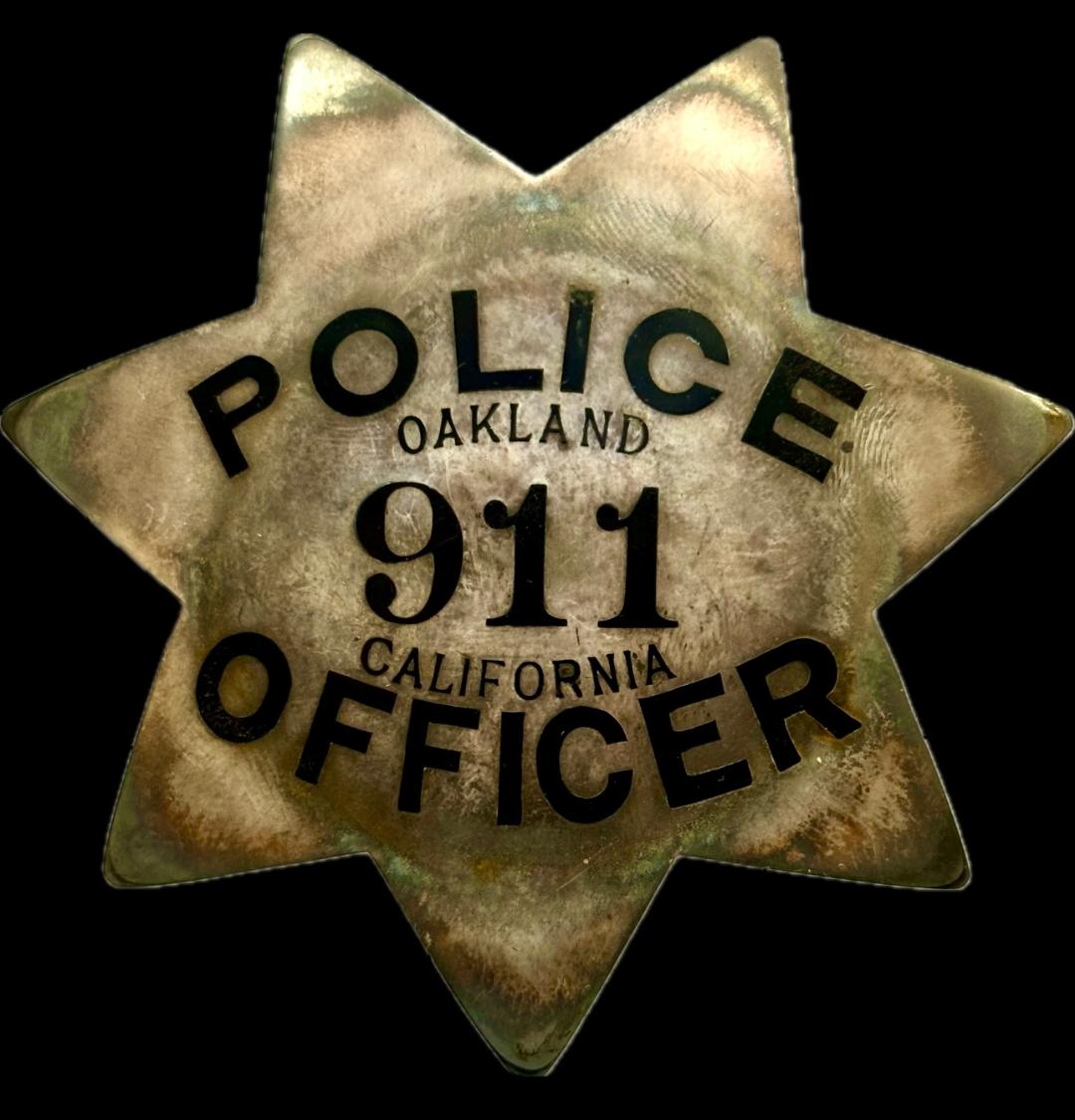 Oakland Police star No. 911 made by Patrick M-K Co. S. F. in  Sterling Silver.