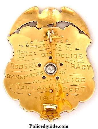 Back of badge showing presentation and hallmark.  “ Presented to Chief of Police Robert P. Tracy by members of Oakland Police Dept. 1943.  Made by Block Jewelery Oakland, CAL.  14k gold in 1943.