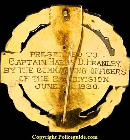 Back of badge showing presentation:  Presented to Captain Harry D. Heanley By the Commanding Officers of the 2nd Division June 7th, 1930.