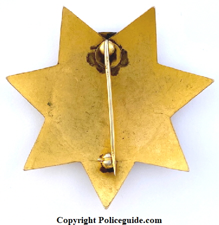 Back of Reno Police Dept. Captain Traffic badge made by Irvine & Jachens.