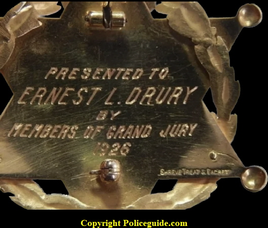 Back of San Francisco Jury Foreman 1926-27, Presented to Ernest L. Drury by Members of Grand Jury 1926.  Made by Shreve Treat & Eacret Company". Badge is made from14K solid gold and weighs 14.78 grams.