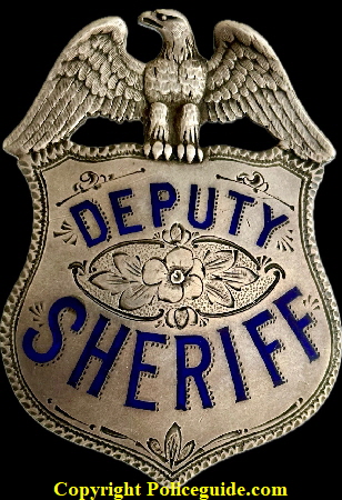 Alameda Co. Deputy Sheriff eagle top shield, Presented to Jack Banchio by Frank Barnet Sheriff 1923.  Sterling silver with hard fired blue enamel.