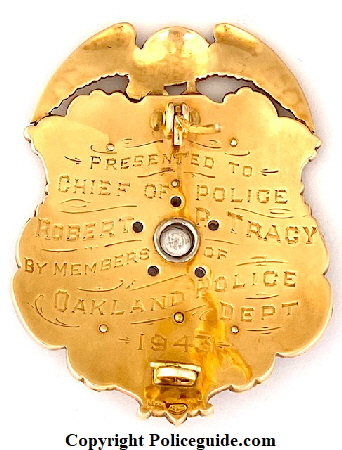 Back of badge showing presentation and hallmark.  “ Presented to Chief of Police Robert P. Tracy by members of Oakland Police Dept. 1943.  Made by Block Jewelery Oakland, CAL.  14k gold in 1943.