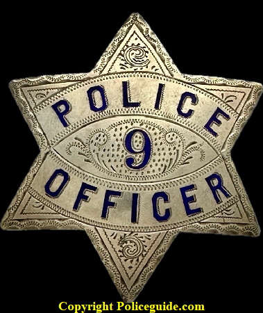 Reno Police badge No. 9, made of sterling silver with hard fired blue enamel. Reno Police badge No. 9, made of sterling silver with hard fired blue enamel.