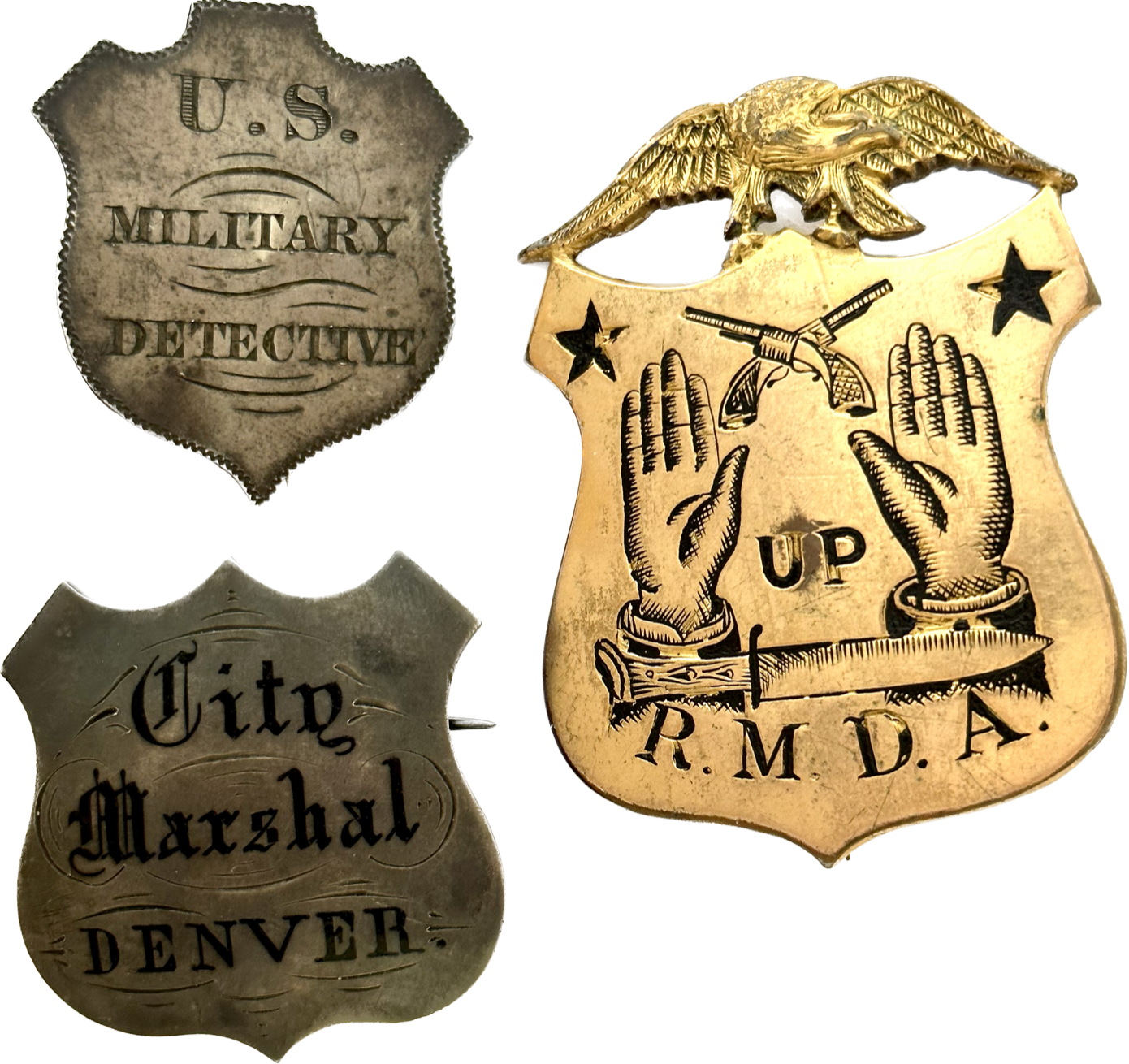 Badges of David Cook  Personal shields worn by Col. David J. Cook during his fascinating career in law enforcement include his Civil War U.S. Military Detective shield, City Marshal Denver shield and his Rocky Mountain Detective Association shield.