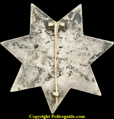 San Francisco Police star No. 98 was issued to John W. Caples on April 26, 1894.  Made of sterling silver with hard fired black enamel lettering.